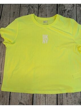 NEW. DKNY cropped work out tee. New, never used. Dry breathable fabric